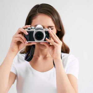 female-photographer-with-camera-photographing_329181-20944